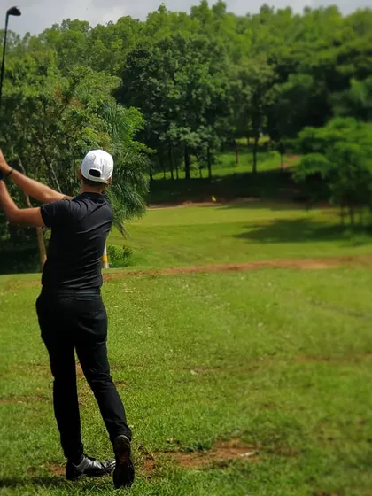 Holding the finish is a great habit that shows commitment to the shot. This pose reflects the culmination of a well executed swing, a goal we strive for in every lesson.