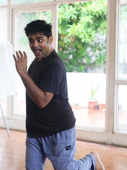 An actor kneels during a "Gretel" rehearsal.