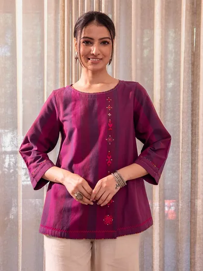 The Haveli Top in violet, coordinated with matching pants. The Soof embroidery on the yoke adds a touch of elegance to this comfortable, stylish top.