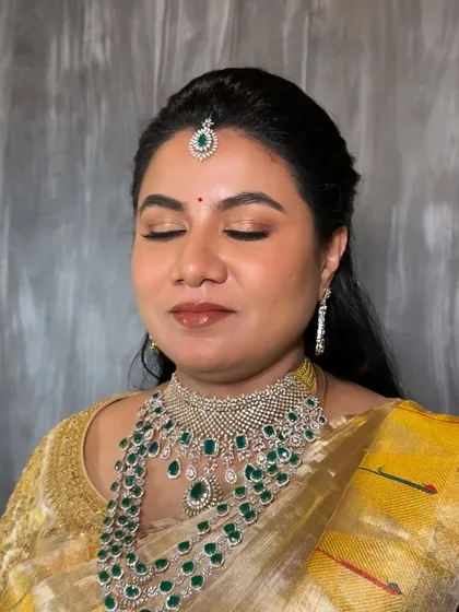 A closer look at the soft glam style I specialize in. This shows my focus on creating a luminous, skin-like finish with beautifully blended eyeshadow in warm, natural tones and a glossy lip that enhances her features.