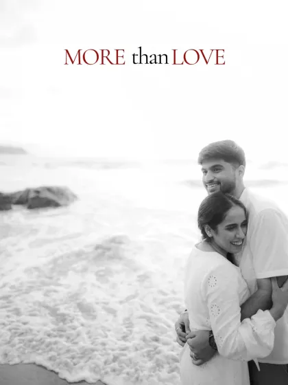 A black and white portrait with a touch of color in the text, creating a modern and artistic feel. The couple's embrace feels warm and genuine, a perfect memory from their pre wedding shoot.