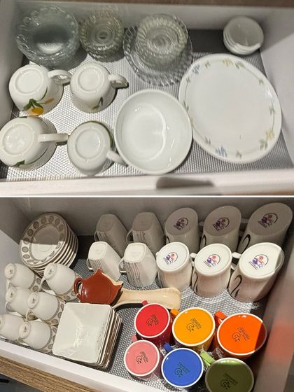 Two drawers showing different sets of tea cups and saucers. We organize them to be easily accessible for your daily chai or for when you have guests over.