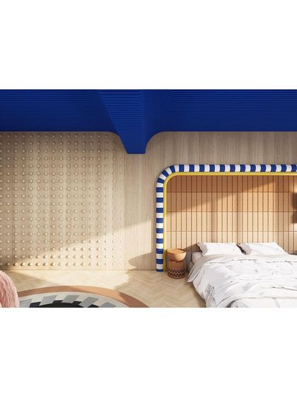 A view of the bedroom and lounge area, showing the cohesive yet distinct design of each space.