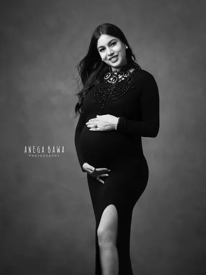 A classic three-quarter portrait in black and white. This is a perfect example of a timeless, elegant maternity photo that will be cherished for years.