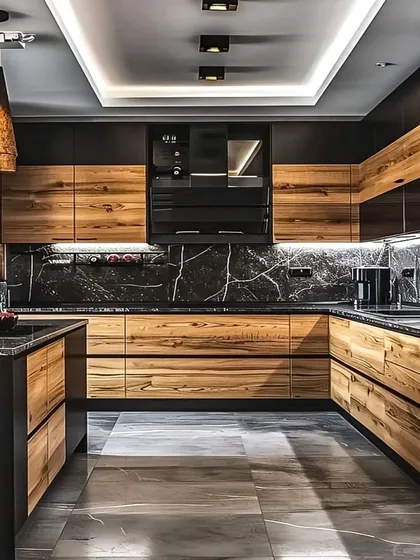 We love creating kitchens that are both beautiful and highly functional. This U-shaped kitchen design combines the natural warmth of wood-grain cabinets with the bold statement of black marble countertops and backsplash, complete with integrated appliances and ambient lighting for a professional feel.