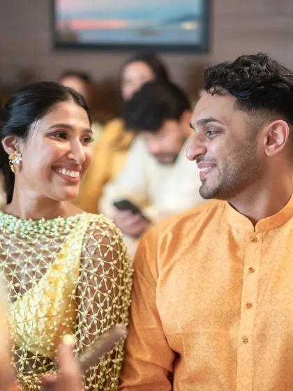 A quiet, happy glance between the couple during their haldi ceremony.