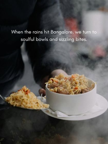 A steaming bowl of rice being served on a rainy day in Bangalore. This image captures the essence of our soulful monsoon menu, which features comforting dishes from Asian soups to Italian pastas.