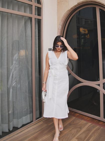 A walking shot, showing the movement of the white dress.