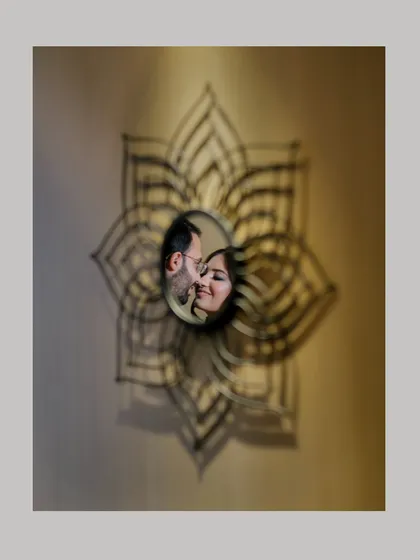 Sometimes the most creative shots happen spontaneously. Using a decorative mirror, I framed this couple's reflection to create an artistic and intimate portrait that feels like a secret glimpse into their world.