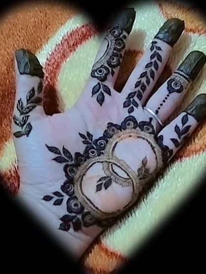 A romantic and minimalist design featuring two interlocking rings surrounded by delicate leaves. This is a perfect choice for an engagement party or anniversary celebration.