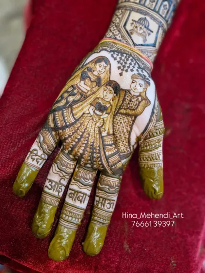 Another angle of the beautiful family portrait mehendi, showing the names of loved ones on the fingers. It’s a beautiful way to keep your family close on your big day.