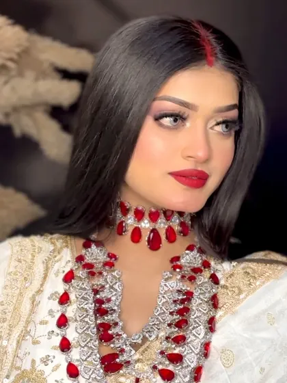 A portrait from my Aishwarya Rai Cannes look recreation. The focus is on the flawless skin, bold red lip, and the striking red sindoor line.