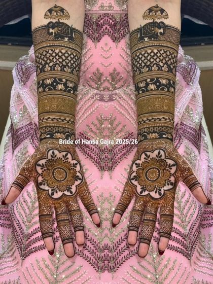 This design is a celebration of traditional motifs. The palms feature a floral mandala, while the arms are adorned with royal elephants under a chatri (umbrella), symbolizing grandeur.