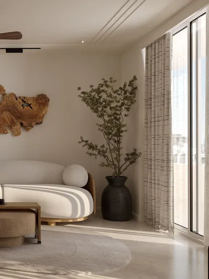 A live-edge wood log is mounted as a striking art installation, bringing an organic and sculptural element into this modern living space.