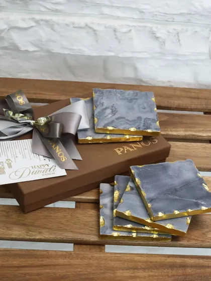 Gifting made simple yet sophisticated. Our grey marble coasters with gold-leafed edges are presented in a signature Panos box, making for a timeless and elegant housewarming or corporate gift.