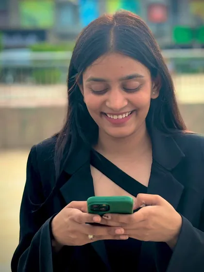 A candid moment checking my phone. I stay connected to provide legal updates and remain accessible to my clients throughout the day.