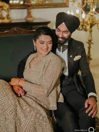 A cozy moment between the couple. Her makeup is soft and romantic, perfect for these intimate photos.