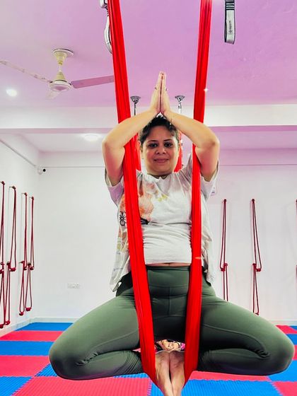 The Baddha Konasana, or bound angle pose, in the hammock allows for a deep yet gentle hip-opening stretch while finding a moment of meditative calm.