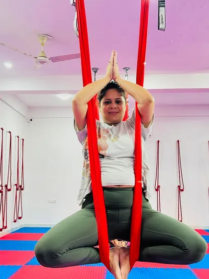 The Baddha Konasana, or bound angle pose, in the hammock allows for a deep yet gentle hip-opening stretch while finding a moment of meditative calm.