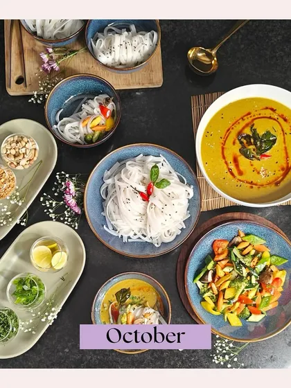 A stunning top-down shot of our Khow Suey spread from an October event. It features the rich curry, noodles, and a variety of fresh condiments, capturing the essence of this beloved dish.