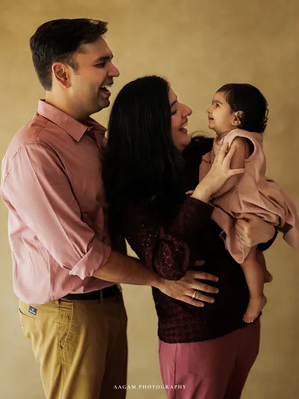 A candid family portrait filled with genuine laughter and connection. This is a perfect example of a lifestyle session, where the goal is to capture the real, unscripted moments that define your bond.