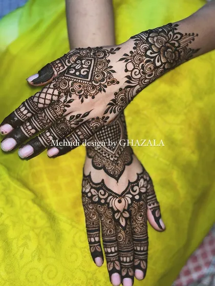 A matching set of party-wear designs, with one hand featuring a heart motif and the other a floral pattern.