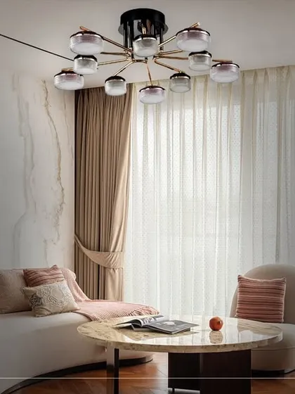 A modern sputnik-style chandelier with smoked glass globes serves as a striking focal point. This fixture is a masterpiece of contemporary design, adding a sculptural element to the room.