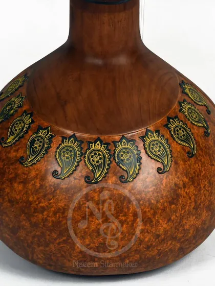 The back of the Zen+ sitar, showing a simple but elegant hand-painted paisley design on the gourd.