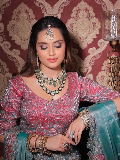 Glam meets elegance. This luxe look with a pink and teal lehenga is perfect for a bridesmaid or close family member who wants to look like royalty.