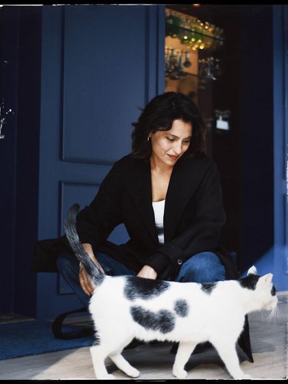 Another sweet interaction from the same series, capturing the gentle nature of both the person and the animal.