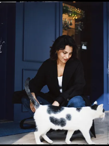 Another sweet interaction from the same series, capturing the gentle nature of both the person and the animal.