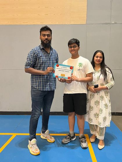 A player and his family celebrate his completion of the summer camp. We love involving parents in their child's basketball journey.