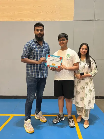 A player and his family celebrate his completion of the summer camp. We love involving parents in their child's basketball journey.