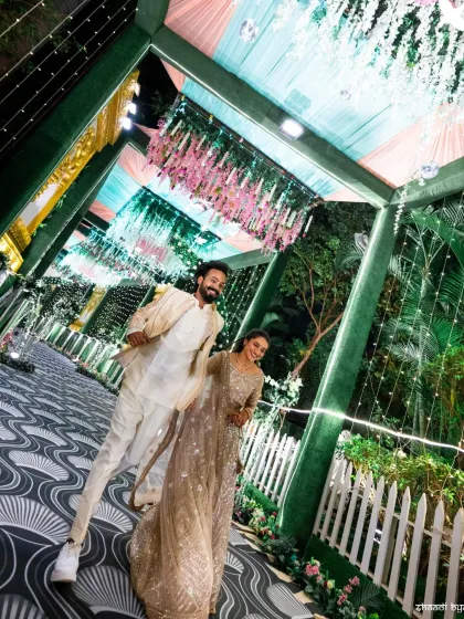 A low-angle shot that makes the couple and the decor look grand and impressive. It’s a creative perspective that adds a unique touch to the wedding album.