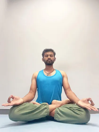 Seated in Padmasana, or Lotus Pose, for meditation. This classic posture helps to keep the spine straight and the mind focused, creating a stable foundation for inner exploration.