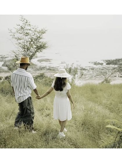 A "follow me" shot leading towards a beautiful coastal view, symbolizing the start of a new adventure together.