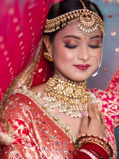 A soft, romantic bridal look with a focus on glowing skin and warm, shimmery eyes. This showcases the versatility of our students' skills.