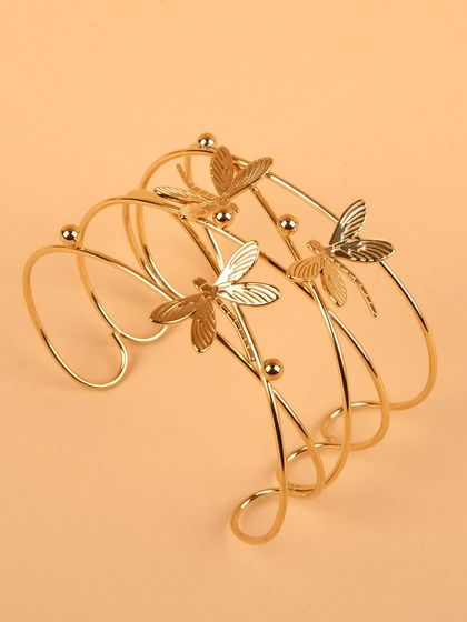 An angled view of the dragonfly cuff bracelet.