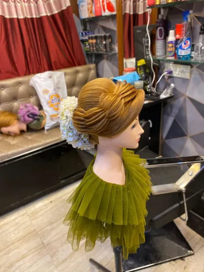A side view of the layered updo, showing the clean lines and structure. My classes focus on building a strong foundation in hairstyling.