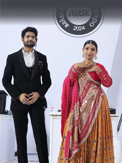 On stage at the Aakar Beauty Expo with a model showcasing my bridal nail art. It was a great experience demonstrating my techniques to a live audience.