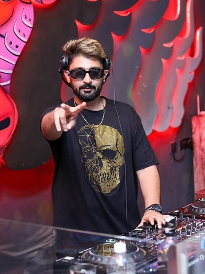 Pointing to the camera, inviting everyone to the party.