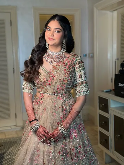Neyomi's engagement look was all about timeless beauty with a modern glow. I focused on delicate details and radiant simplicity to create a look that was the perfect start to her bridal journey.