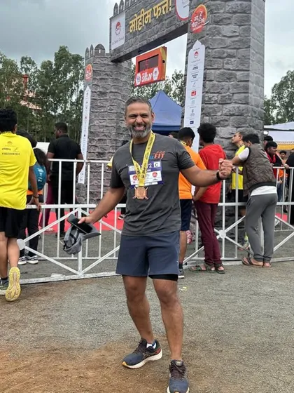 A happy finisher at the Satara Hill Half Marathon. Every finish line is a victory.