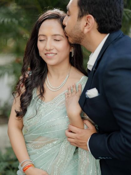 A gentle kiss on the forehead, a gesture of love and protection captured during Shalini and Karan's intimate Roka ceremony.