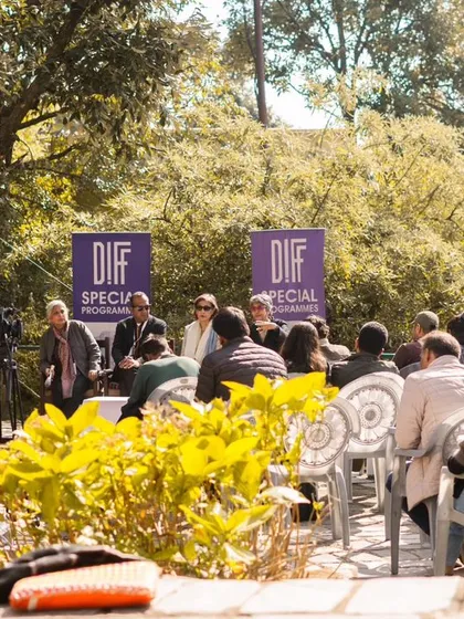 Event coverage isn't just about the main stage; it's also about the quieter, more focused moments. This photo of an outdoor panel discussion at a film festival shows my ability to document talks and presentations in a natural and engaging way.