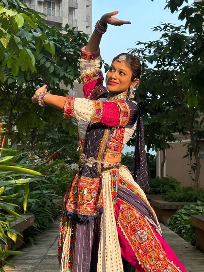 A classic dance pose in a not-so-classic outfit. This picture shows how the unique dhoti-style lehenga moves with the dancer.