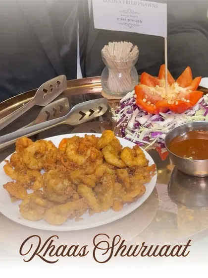A 'Khaas Shuruaat' or special beginning with our Golden Fried Prawns. This dish is perfectly crispy and served with a tangy dipping sauce, ideal for any celebration.
