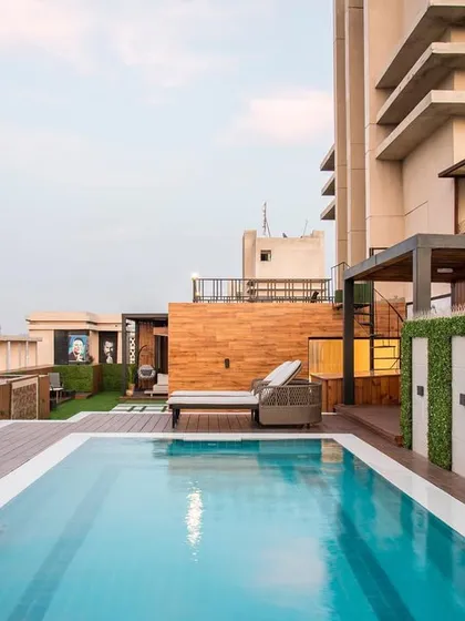 I believe a home should be a retreat, and this penthouse rooftop is the ultimate urban oasis. I designed this space with a pool, custom decking, and comfortable lounge areas to be perfect for both quiet relaxation and entertaining guests against the city skyline.