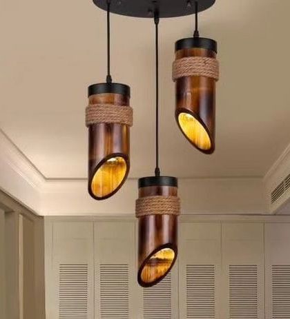 This cluster of three hanging lights is made from sections of dark-stained bamboo, each wrapped with natural rope. The angled cut of the bamboo directs light downwards, making them a great option for task lighting over a kitchen island or bar.