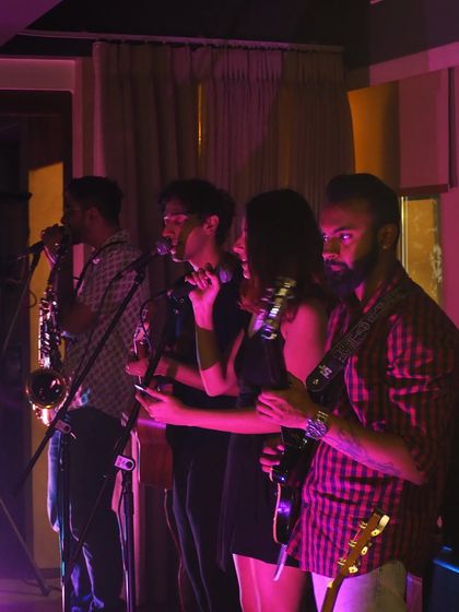 A snippet from a dreamy show with my full band at a cozy venue. The purple lighting set the perfect mood.